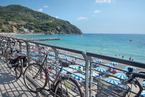 a group of bikes parked next to a beach at Affittacamere Monica in Levanto