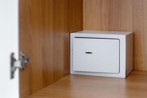 a white box sitting on top of a wooden door at Affittacamere Monica in Levanto