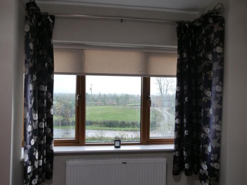 a window with a view of a field at Cozy 2 Bedroom House in Mullingar in Mullingar