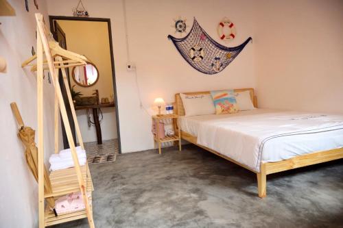 a bedroom with a bed and a ladder in it at Homestay Văn Vĩnh Hy 3 in Ninh Hải