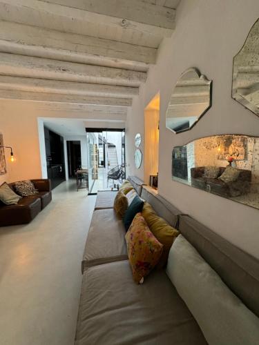a living room with a couch and a fireplace at Unique Townhouse with rooftop pool in Estepona