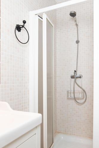 a shower with a glass door in a bathroom at Alma de Zahara in Zahara de los Atunes