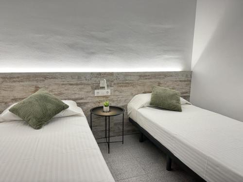 Ένα ή περισσότερα κρεβάτια σε δωμάτιο στο Agi Pi Sunyer Apartments