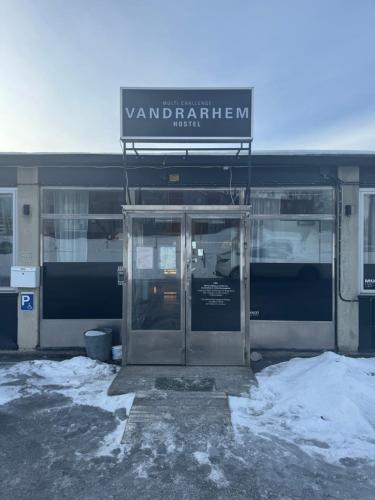an entrance to a building with a revolving door at Multi Challenge Hostel in Östersund