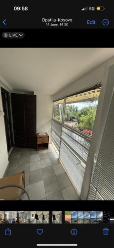 a view of a living room with a large window at Rooms & Apartments Semić in Opatija