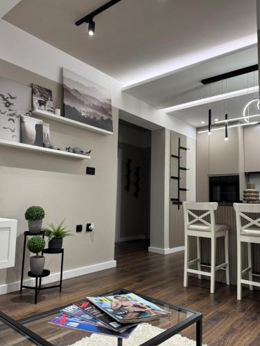 TV i/ili multimedijalni sistem u objektu Premium Line Apartman