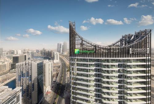 a view of a tall building in a city at Holiday Inn Dubai Business Bay by IHG in Dubai
