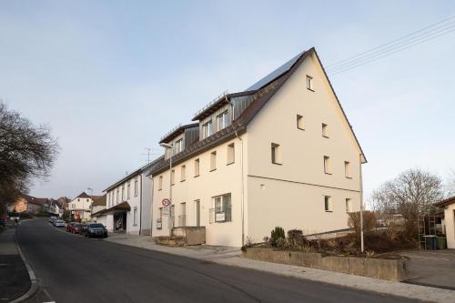 a large white building on the side of a street at Luxury Apartment im Luftkurort Tengen in Tengen