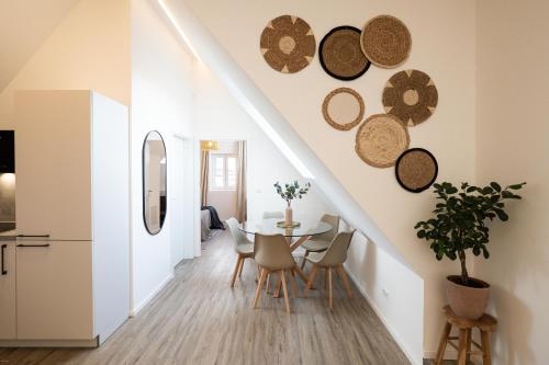 a kitchen and dining room with a table and chairs at Luxury Apartment im Luftkurort Tengen in Tengen