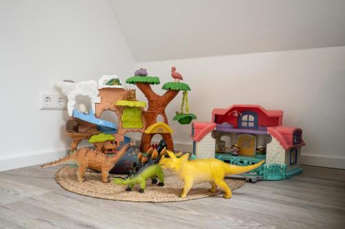 a group of toy dinosaurs and a play house at Luxury Apartment im Luftkurort Tengen in Tengen