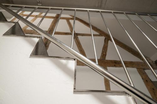 a metal stair railing in a room with at Luxury Apartment im Luftkurort Tengen in Tengen