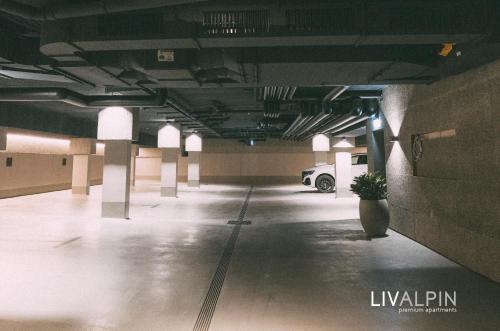 an empty parking garage with a car parked in it at LIVALPIN 2Enjoy in Garmisch-Partenkirchen