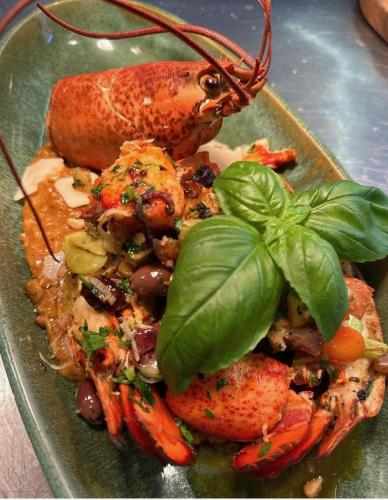 a plate of food with shrimp and other vegetables at Logis Hôtel La Fenière in La Bouilladisse