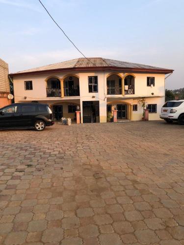a building with a car parked in front of it at général in Yaoundé