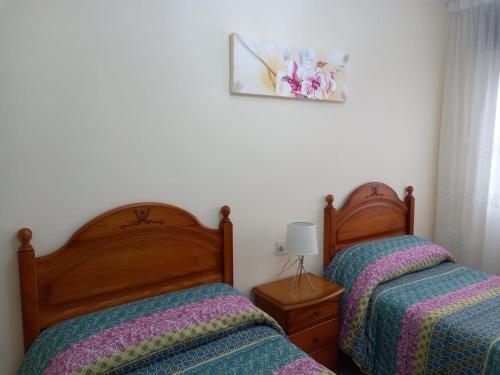 Postel nebo postele na pokoji v ubytování Albergue Agarimo