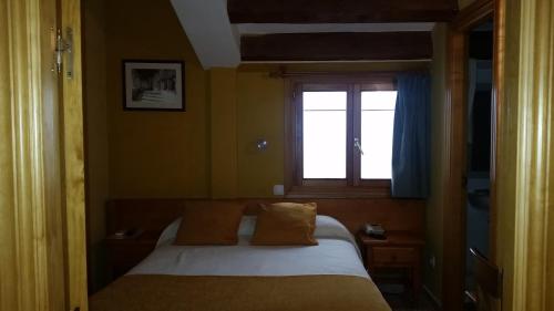 Un pat sau paturi într-o cameră la San Miguel