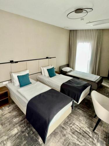 Ein Bett oder Betten in einem Zimmer der Unterkunft DReAM Boutique Residence