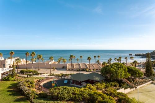 an aerial view of a resort with the ocean in the background at Grande Real Santa Eulalia Resort & Hotel Spa in Albufeira