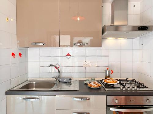 a kitchen with a sink and a counter top at Patio on the Simius beach in Simius