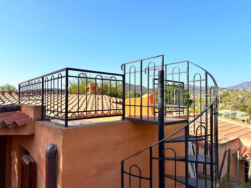 a balcony on top of a building at Patio on the Simius beach in Simius