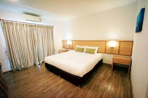 Tempat tidur dalam kamar di Donchan Residence