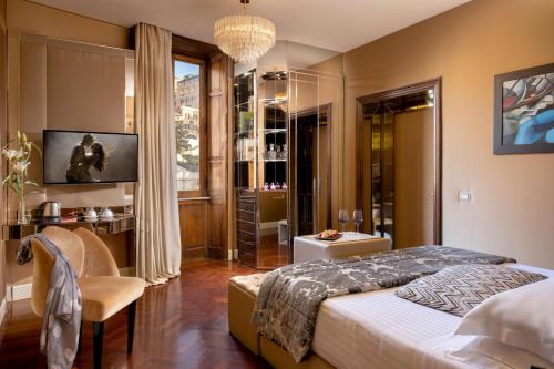 a bedroom with a large bed and a window at The Inn at the Spanish Steps Luxury Collection - The Inn at the Spanish Steps in Rome