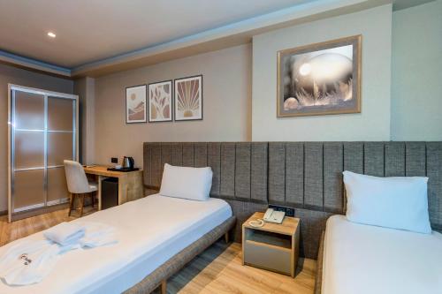 Postel nebo postele na pokoji v ubytování EViM HOTEL ÇORLU