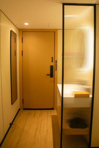 a door leading into a room with a counter at Ruby Hotel in Vientiane