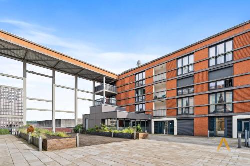an exterior view of a brick building at A Stylish Retreat in Esch Urban Landscape in Esch-sur-Alzette