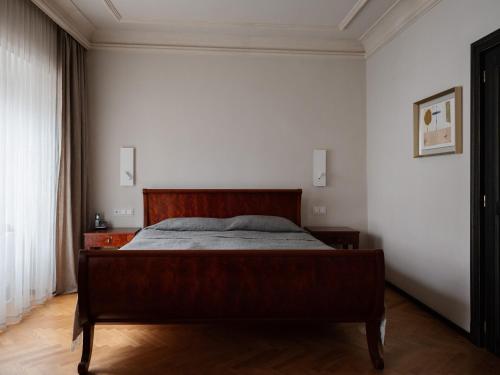 a bedroom with a bed in a white wall at Hotel Pod Różą in Kraków