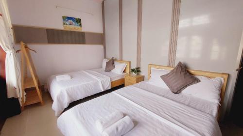Postel nebo postele na pokoji v ubytování Mekong INN