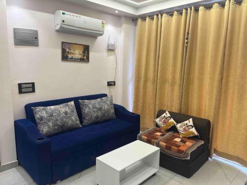 a living room with a couch and a air conditioner at Modern Luxury Deecon Valley 2BHK Flats 3Double Beds with Terrace View Tapovan Rishikesh in Rishīkesh