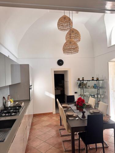 a kitchen and dining room with a table and chairs at Isabel’s house in Vietri sul Mare