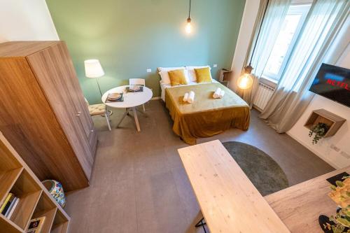 a small living room with a couch and a table at LittleSuiteBande NERE in Milan