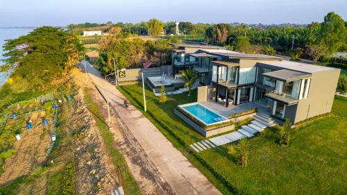 an aerial view of a house with a swimming pool at Sararin Luxury Villas in Nong Khai
