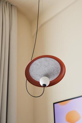 a light fixture hanging from a wall at Gästeresidenz Pelikan Viertel Hannover in Hannover