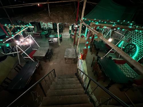an overhead view of a restaurant at night with lights at The Saffron Suites in Sasupāda