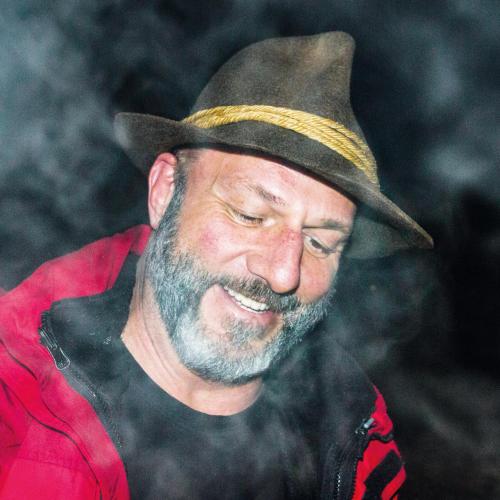 a man wearing a cowboy hat is smiling at Apart Solaria - Wohnungen in Au-Schoppernau in Au im Bregenzerwald