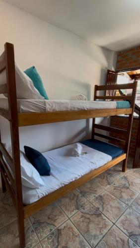 Postel nebo postele na pokoji v ubytování Cacau Biruta