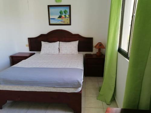 Postel nebo postele na pokoji v ubytování Apartment Rozarka Soficu El Edén Dominicus