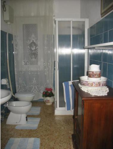 a bathroom with a toilet and a sink at B&B Mare e Monti in La Spezia