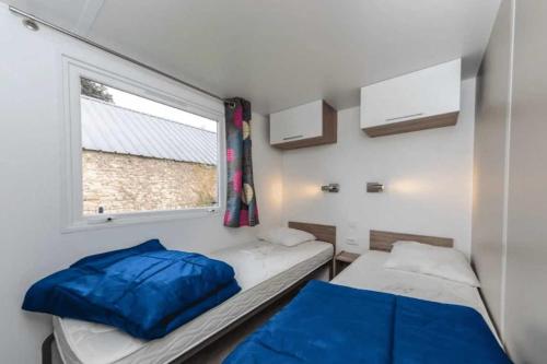 Ένα ή περισσότερα κρεβάτια σε δωμάτιο στο Camping 4 étoiles - Piscine - cca0chh