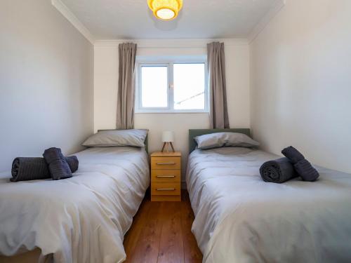 Postel nebo postele na pokoji v ubytování Beachcomber