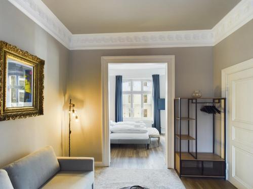 a living room with a couch and a bed at Art Apartments in Hamburg