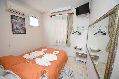 Ένα ή περισσότερα κρεβάτια σε δωμάτιο στο Anz Guest House Pansiyon
