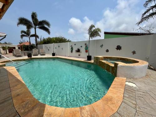 a swimming pool in the middle of a house at Paradera Palms Apt 2 in Paradera