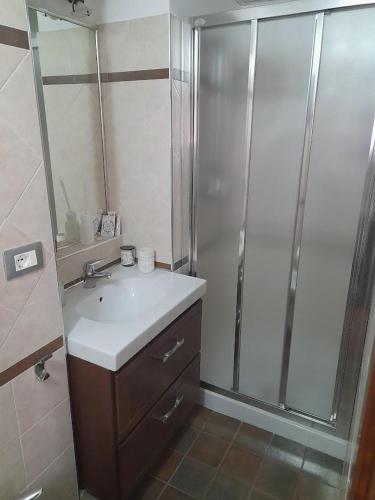 a bathroom with a sink and a shower at Il Lanternino in Tropea