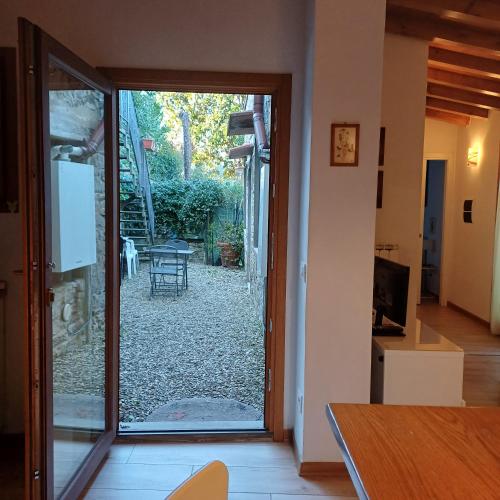 a door to a patio with a view of a yard at Casa Vacanze Ada in Fiesole