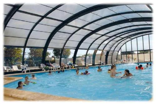 a group of people in a swimming pool at Camping 3 étoiles - Piscine - cca0gbb in Apremont