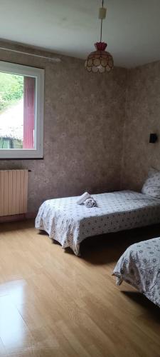 Ένα ή περισσότερα κρεβάτια σε δωμάτιο στο Appartement La Marmotte Compreignac